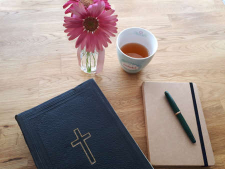 Still life with flowers and notepad