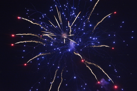 Colorful fireworks at night with blue