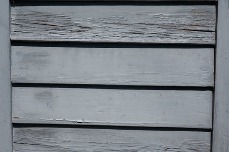 Light blue old wooden slats in the sunlightの写真素材