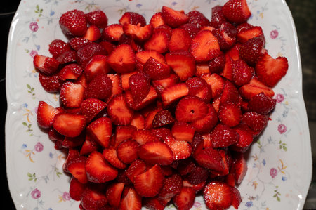 Finely chopped strawberries mixed with jam in a bowlの写真素材