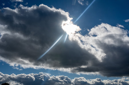 Dark clouds are gathering with sun and blue sky