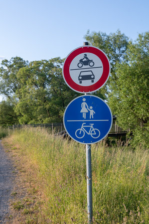 Information sign for pedestrians and vehicles in green natureの写真素材