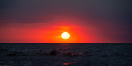 Beautiful orange sunset over the seaの写真素材