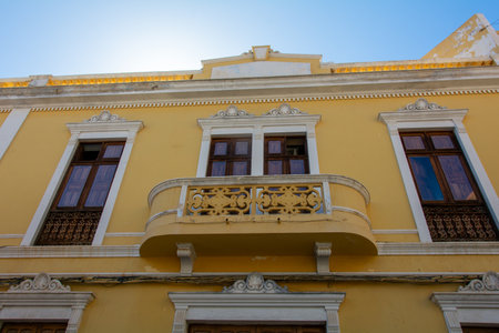 Old yellow house with a balcony in the Spanish town of Galdar on Gran Canariaの写真素材