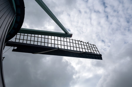 A old windmill blades, in the Netherlands, with overcast skiesの写真素材