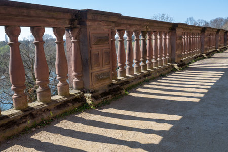 Sandstone balustrade with columns in sunlight