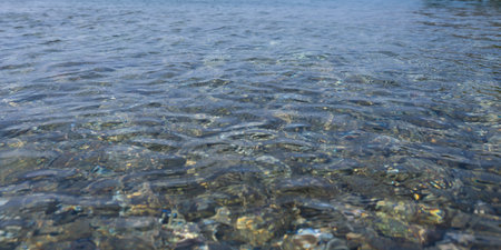 View from above of many stones in the clear water on the sea coast