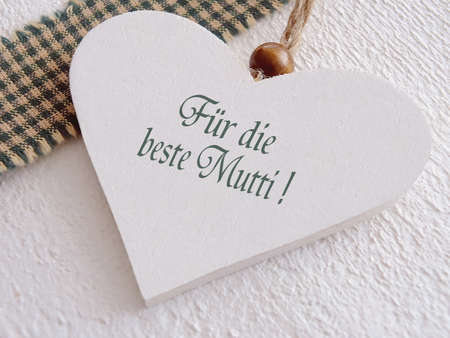 Wooden heart for mothers day with german textの写真素材