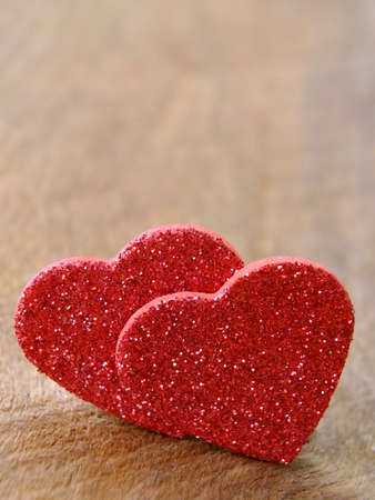 Two hearts on wooden background with copyspaceの写真素材