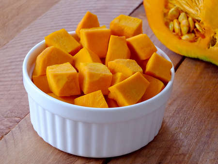 Image of chopped pumpkin on a wooden backgroundの写真素材