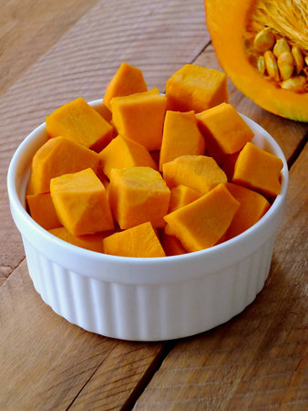 Image of chopped pumpkin on a wooden backgroundの写真素材
