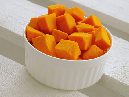 Image of chopped pumpkin on a wooden backgroundの写真素材