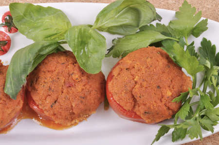 Tomatoes stuffed with tuna, tomato sauce and parsley and basil