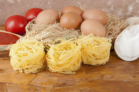 low-protein pasta  spaghetti  with flour and ingredients for the dressingの写真素材