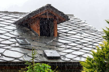 View of the roof of Courmayeur houses with a view of Mont Blanc - Valle d'Aosta - Italyの写真素材