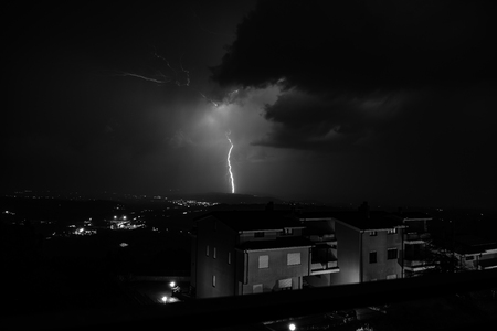powerful flash during a thunderstormの写真素材