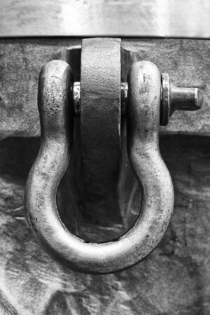 Black and White image of metal swiveling hook