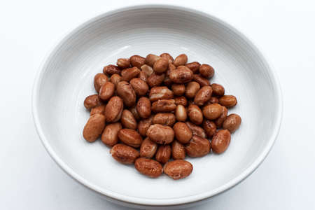 Baked italian borlotti beans in a bowl, isolated on whiteの写真素材