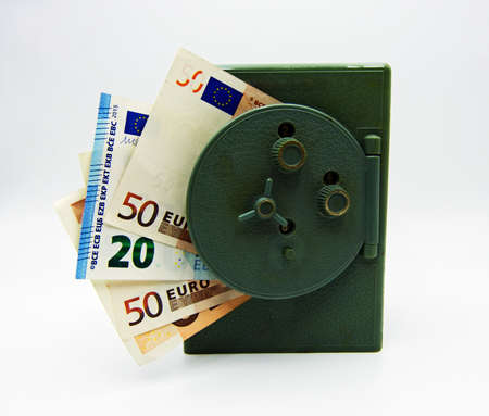 Euro banknote inside an opened safe isolated on white background. Saving money conceptの写真素材