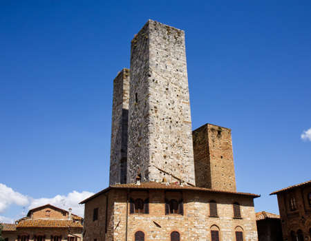 Three towers in the medieval town of San Gimignano.の写真素材