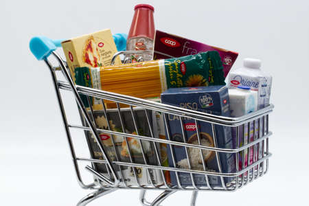 Shopping cart with various original Coop products. Coop is the biggest supermarket chain in Italy. Modern mall shopping conceptのeditorial素材