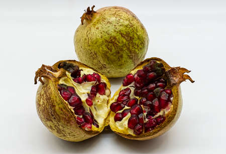 Ripe pomegranate fruit isolated on white background
