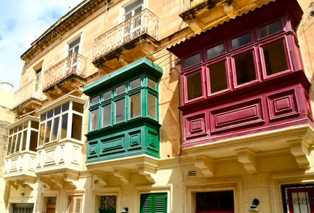 Traditional wooden colorful balconies in center of Valletta. Maltaの写真素材