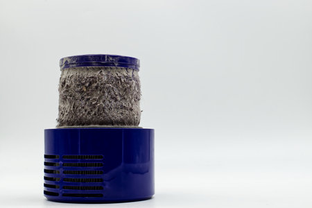 Massively clogged dirty filter of a cordless vacuum cleaner.の写真素材