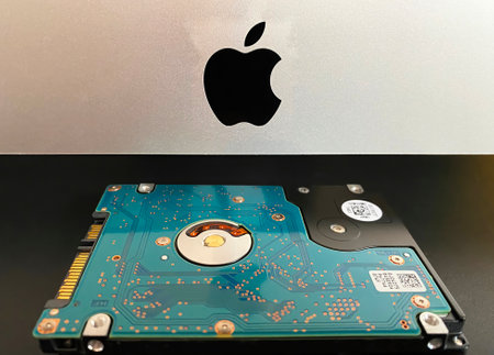 iMac 21,5 inch personal computer made by Apple Computers and MX500 5.5 inch solid state drive