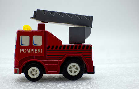 Firemen (Firemen) fire truck toy isolated on white background