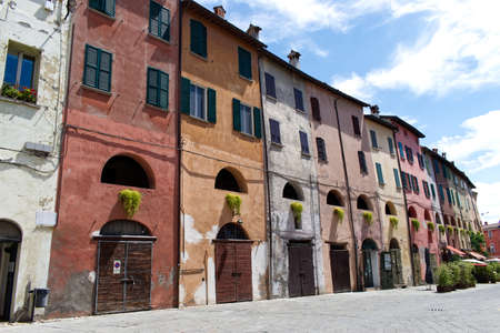 Medieval colored buildings of Brisighella. Old village of Brisighella. Ravenna, Italy.の写真素材