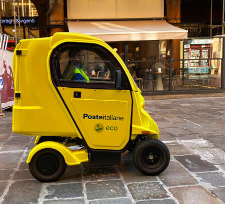 Bologna - Italy - October 14, 2021: Electric mail delivery vehicle used by Poste Italiane. Bologna....