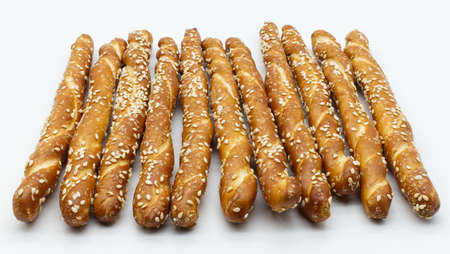 Bread stick with sesame seeds isolated on white background