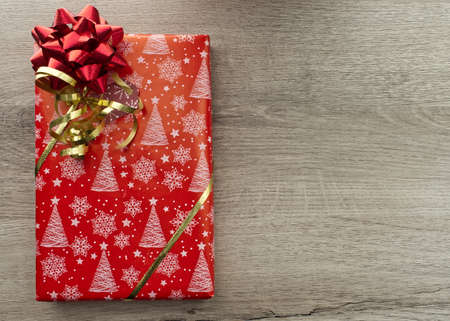 Christmas gifts box on wooden background. Top view with copy space for your textの写真素材