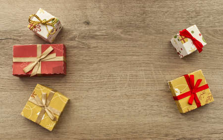 Christmas gifts box on wooden background. Top view with copy space for your text