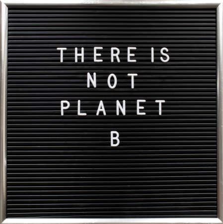 There is not planet B quote on letterboard with white plastic letters. Warning for global warming...