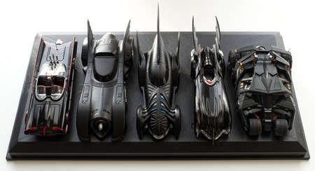 Bologna - Italy - January 11, 2022: Set of five Batmobile from Batman movies on black display.