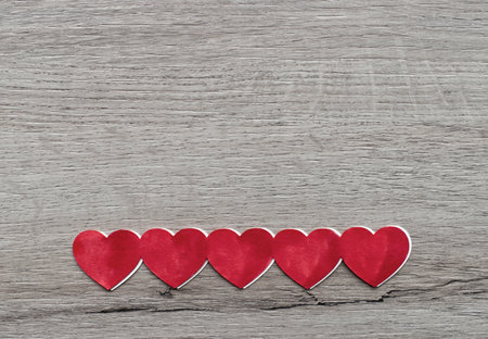 Red Valentines Hearts on wooden background. Place for text, copy space. Top view. Happy Valentine's Day concept.の写真素材