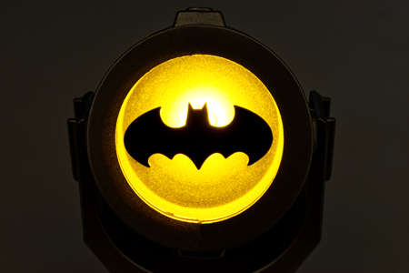 bologna - Italy - January 20, 2022: Illuminated Batsignal device isolated on dark background.のeditorial素材