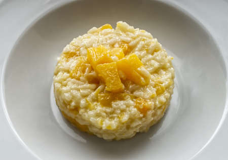 Italian Pumpkin Risotto in a white dishの写真素材