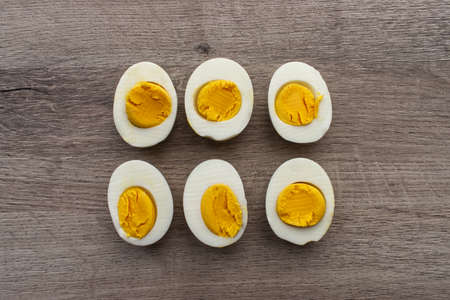 Boiled egg on wooden background. Top view.の写真素材