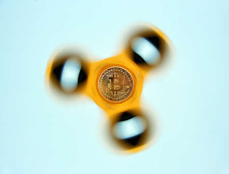 Bitcoin on rotating display on white background. New technological economy concept.