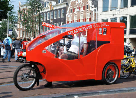 Amsterdam - The Netherlands - August 14, 2018: Fiets Taxi or bicycle taxi in central Amsterdam.