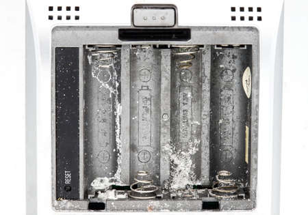 Oxide corrosion inside the battery compartment of an electronic device