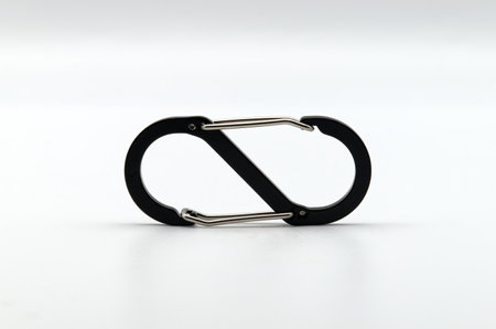 Black and silver carabiner isolated on white background