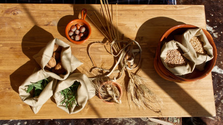 Wheat seeds, hazelnuts, walnuts on wooden table. Healthy and nutrition food conceptの写真素材