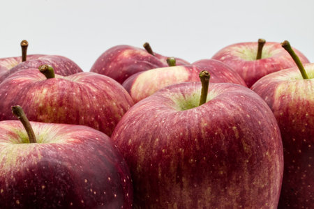 Fresh red apples on white background. Closeups