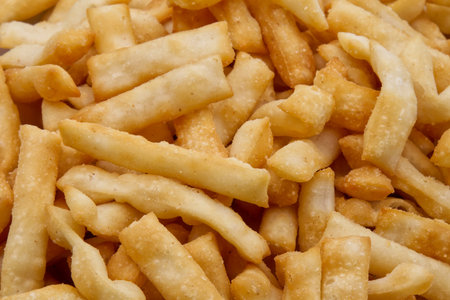 Salted Italian Chiacchiere Salate from Bologna isolated on white.