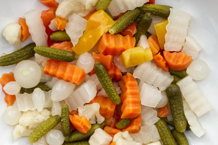 Italian Giardiniera salad, sweet and sour vegetable mix in jar. close upの写真素材