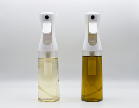 Olive oil spray dispenser isolated on white backgroundの写真素材